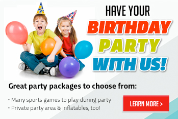 Happy kids with balloons smiling at the camera.