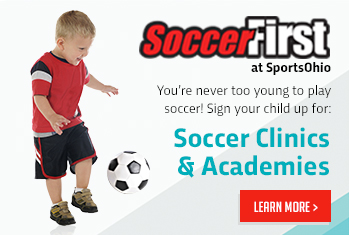 Happy kids with balloons smiling at the camera.